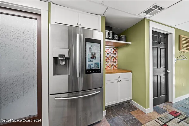 a bedroom with a bed couch and a window