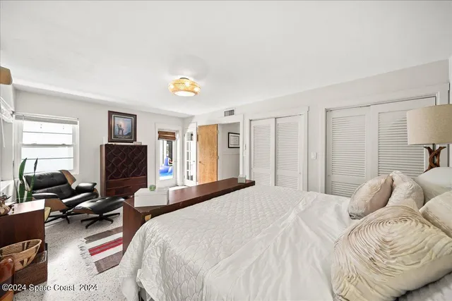 a bed room with furniture and a window