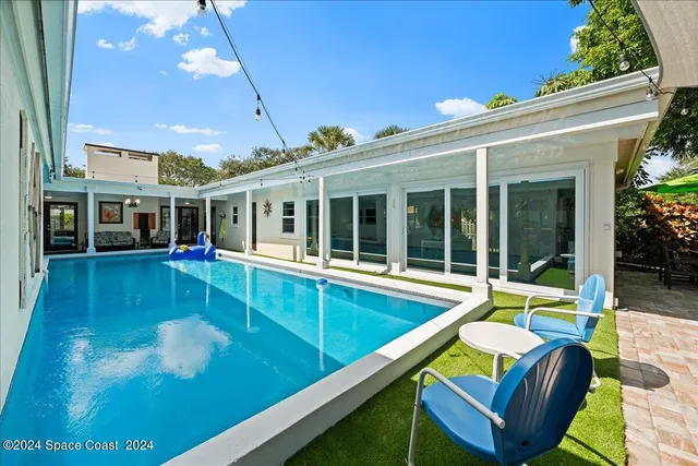 a backyard of a house with lots of green space