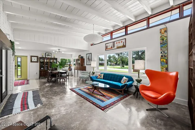a kitchen with stainless steel appliances granite countertop a refrigerator and wooden cabinets