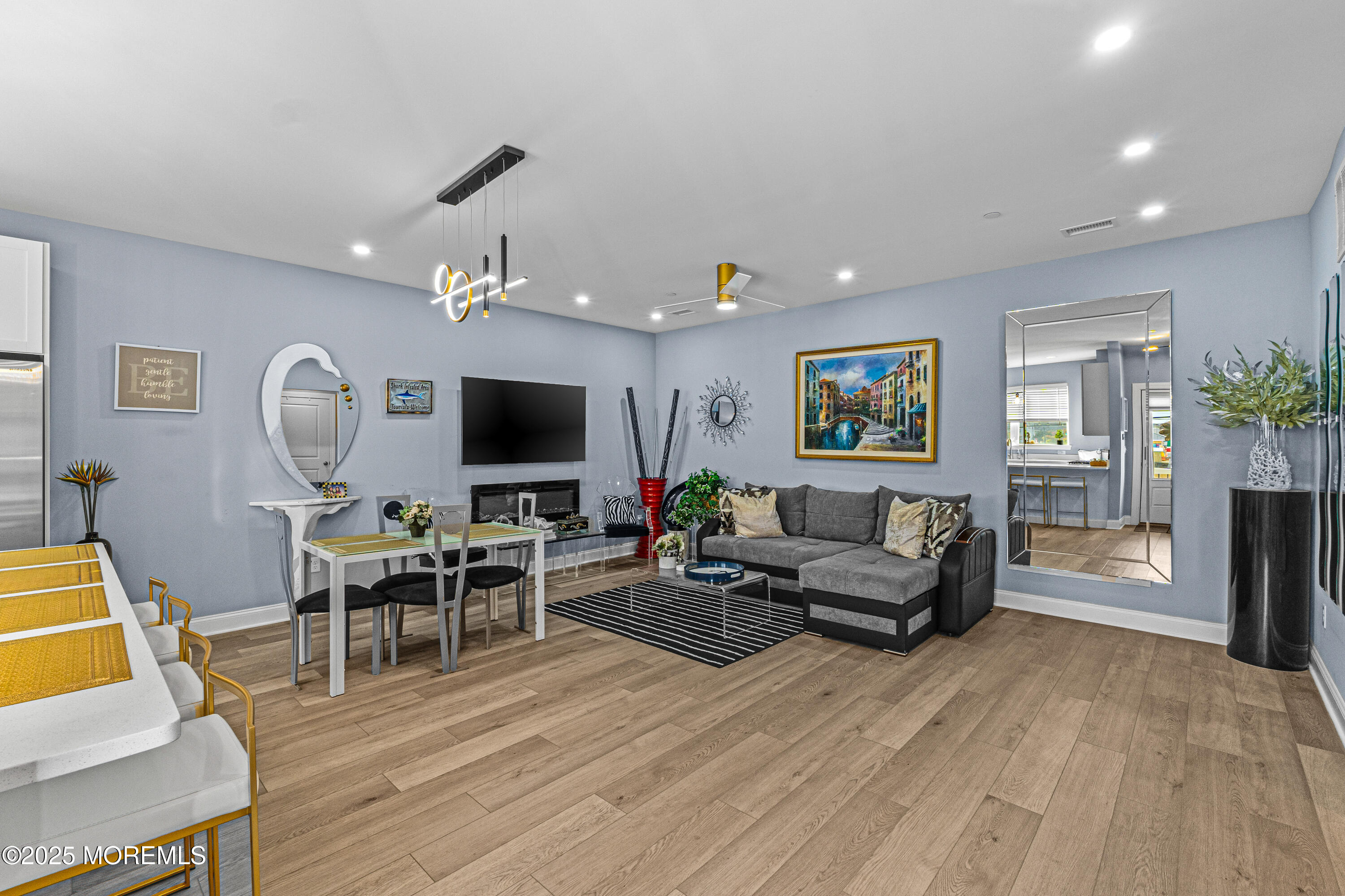 64 Sheridan Avenue, Unit B Seaside Heights, NJ 08751 - Photo 3 of 20 a living room with furniture and a flat screen tv