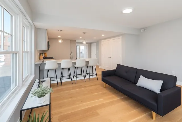 a living room with furniture and a table