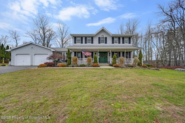 a house view with swimming pool in front of it