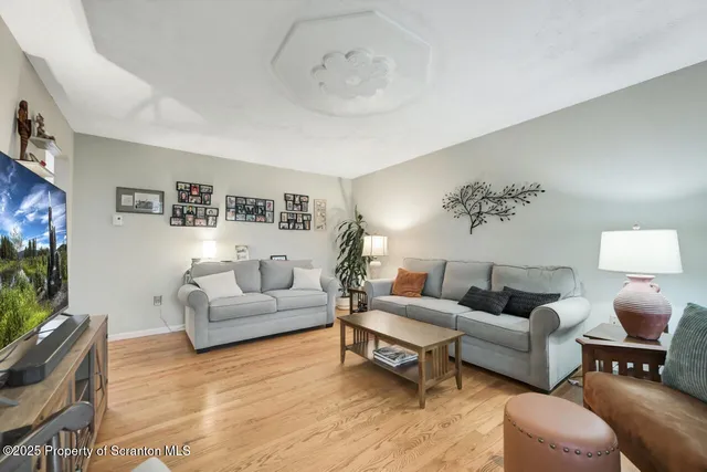 a bedroom with a bed window and a dresser