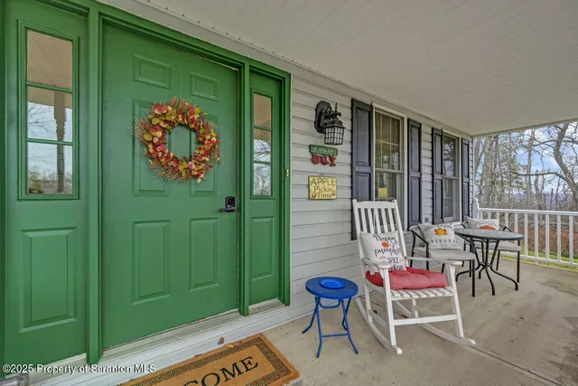 a living room with kitchen island furniture and a kitchen view