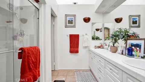 a bathroom with a shower and a mirror