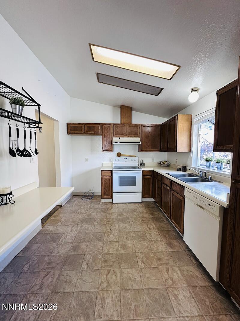1182 Blue Lakes Road Reno, NV 89523 - Photo 8 of 31 a large kitchen with stainless steel appliances granite countertop a stove and a sink