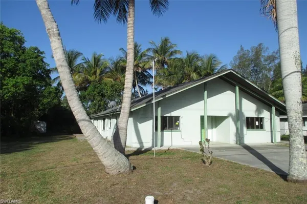 a house with trees in the background