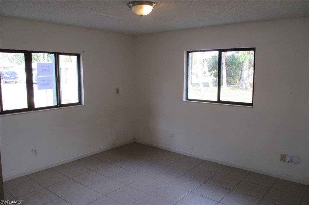5395 Carolina Avenue Naples, FL 34113 - Photo 9 of 11 an empty room with a window