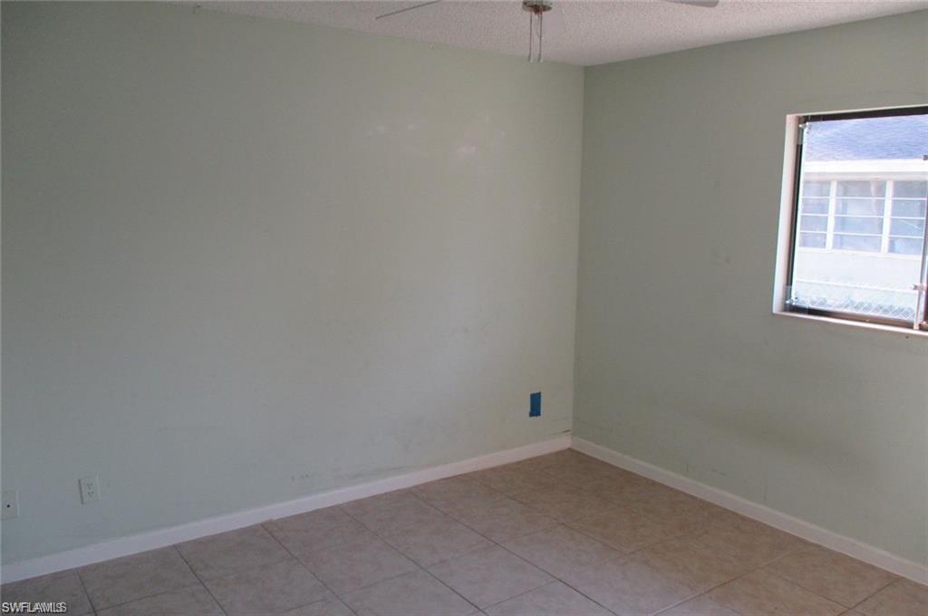 5395 Carolina Avenue Naples, FL 34113 - Photo 10 of 11 an empty room with a window