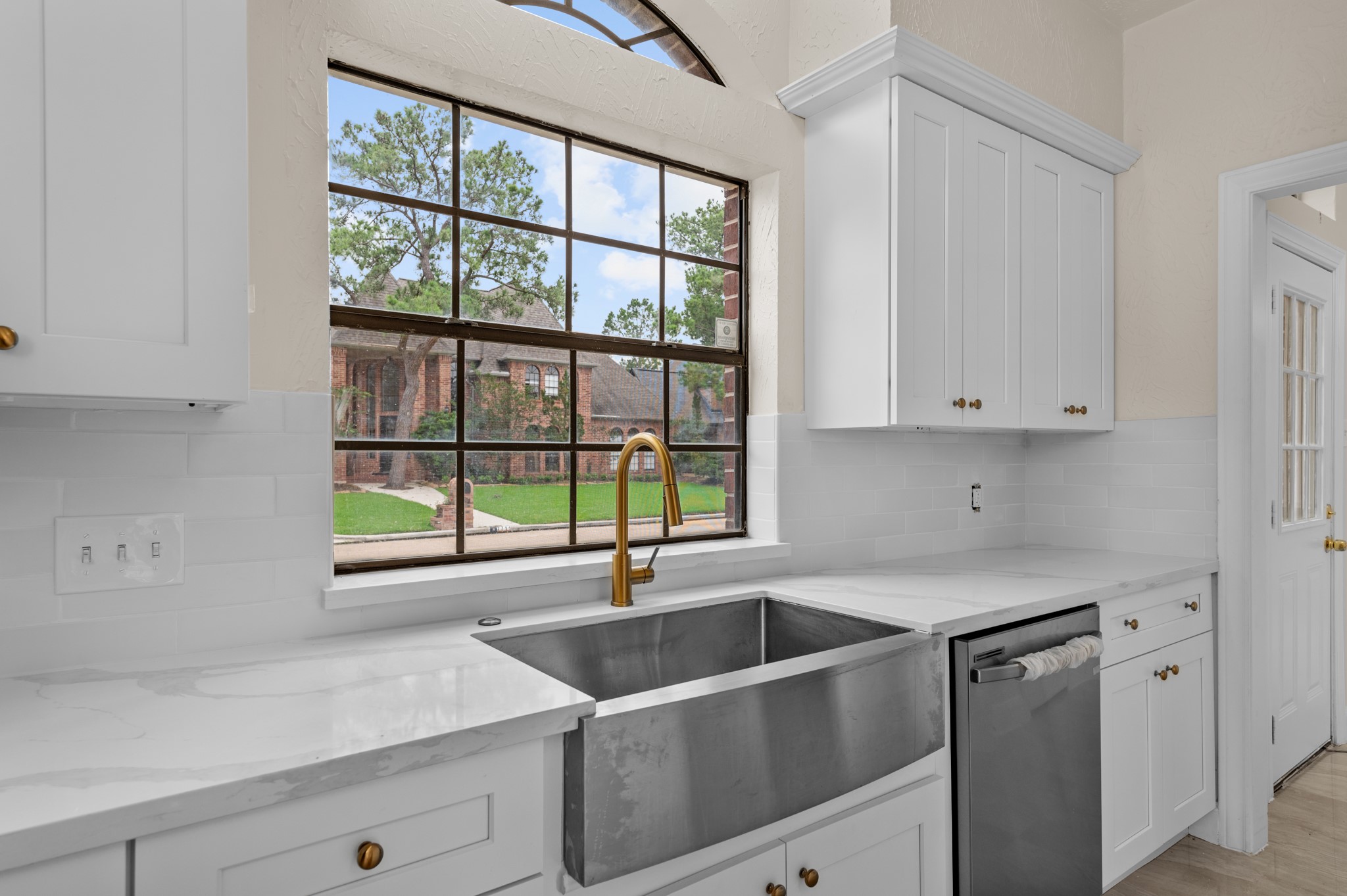 17402 Wilton Park Court Spring, TX 77379 - Photo 36 of 50 a kitchen with a sink and a window