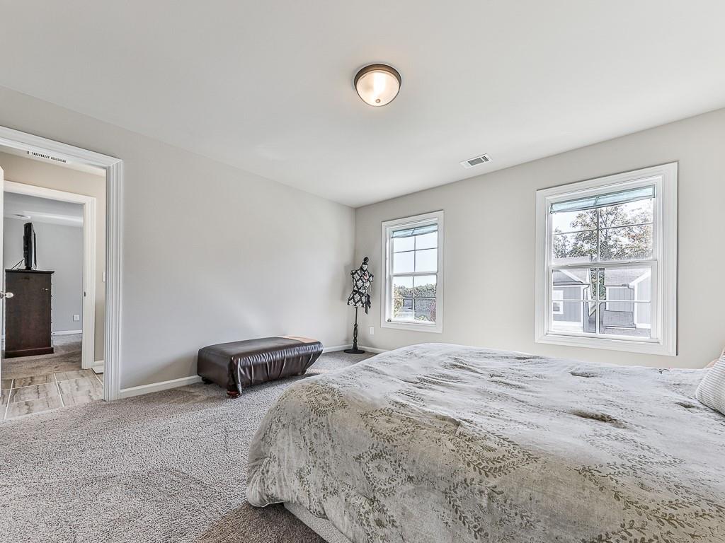 200 Lakeside Place Canton, GA 30114 - Photo 13 of 38 a bedroom with a bed and a window