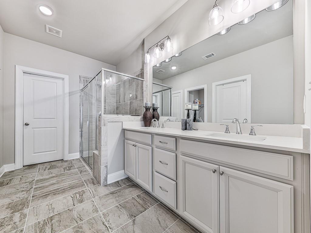 200 Lakeside Place Canton, GA 30114 - Photo 14 of 38 a spacious bathroom with a sink a mirror and a shower
