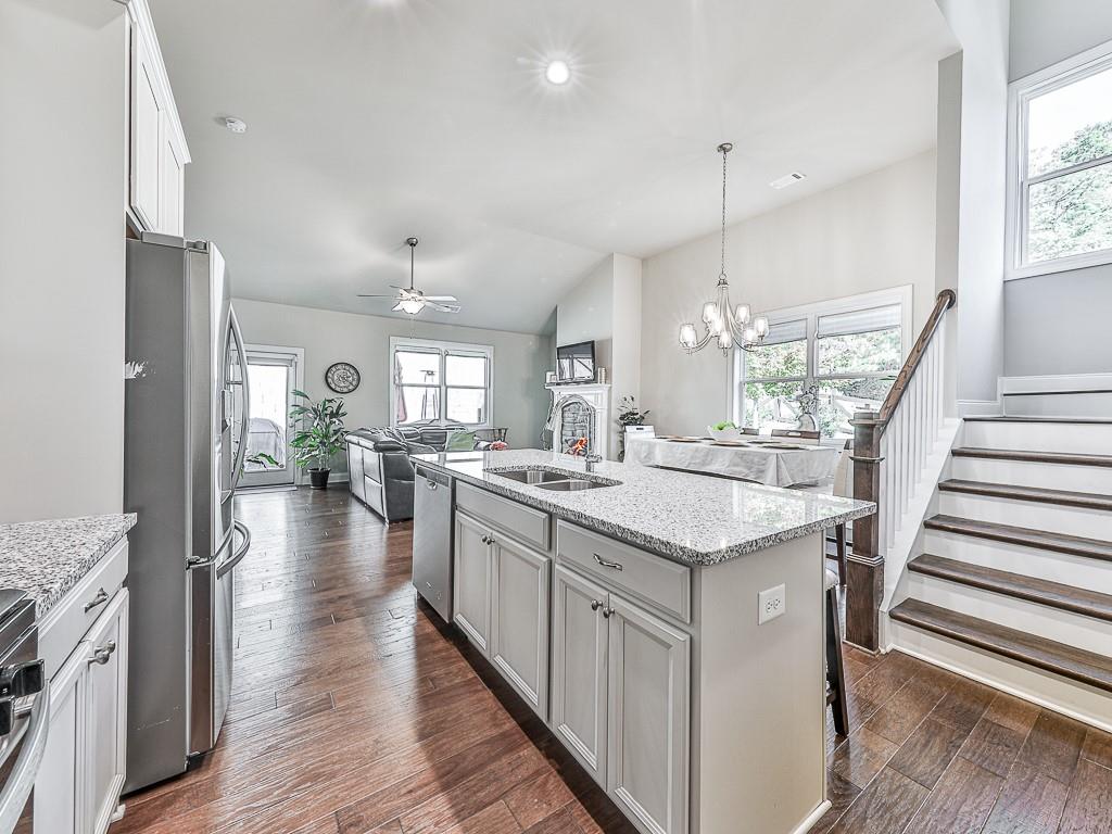 200 Lakeside Place Canton, GA 30114 - Photo 19 of 38 a kitchen with sink stove and refrigerator