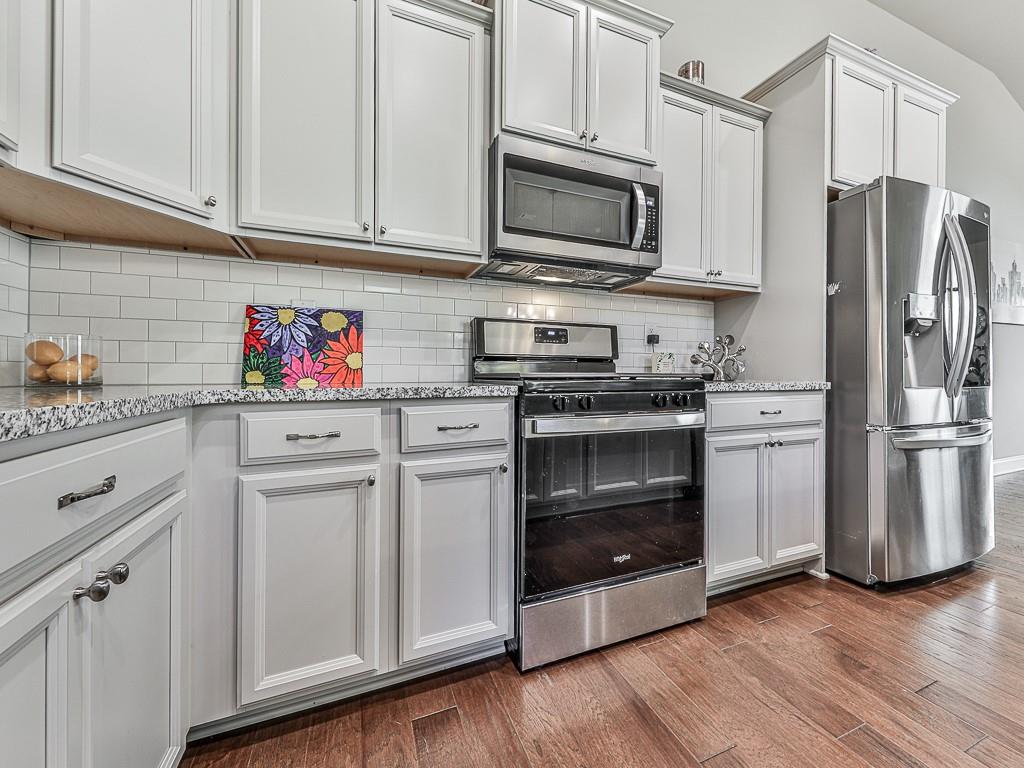 200 Lakeside Place Canton, GA 30114 - Photo 23 of 38 a kitchen with stainless steel appliances white cabinets sink and stainless steel appliances