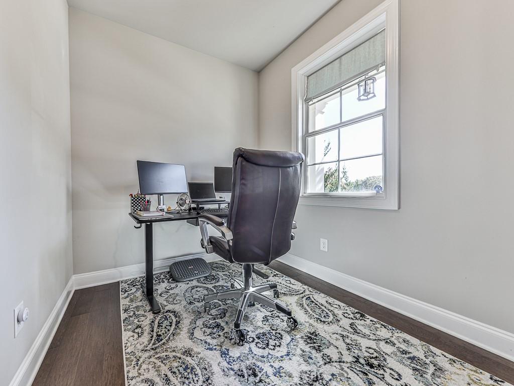 200 Lakeside Place Canton, GA 30114 - Photo 3 of 38 a room with furniture a rug and a window