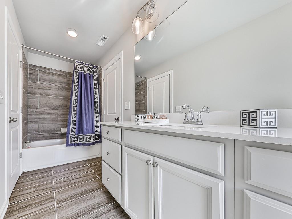 200 Lakeside Place Canton, GA 30114 - Photo 8 of 38 a bathroom with a sink a vanity and a mirror