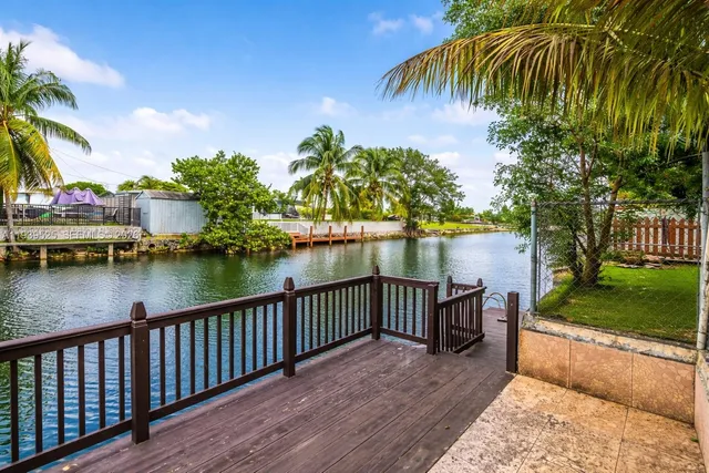 a view of balcony with outdoor space and lake view