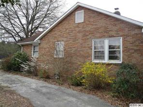 1796 Airport Road Lancaster, SC 29720 - Photo 3 of 16 a brick house with a large windows