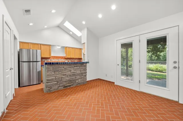 a view of an empty room with a window