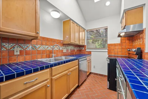 a view of front door with hallway and a window