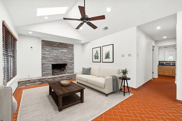 a living room with furniture and a fireplace