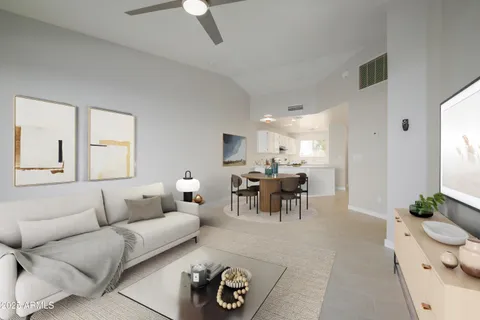 a living room with furniture and a dining table