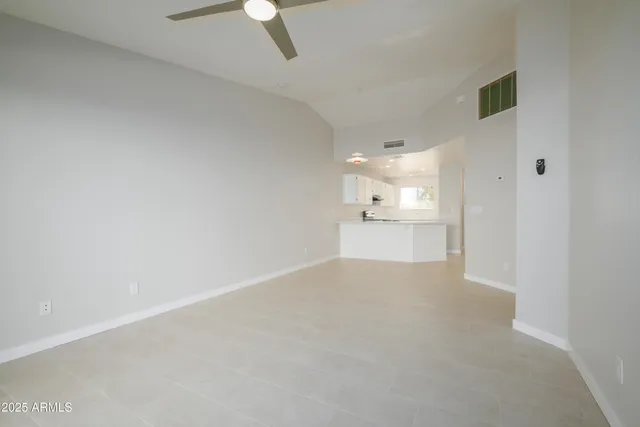 a view of a kitchen with a sink and dishwasher a refrigerator with wooden floor