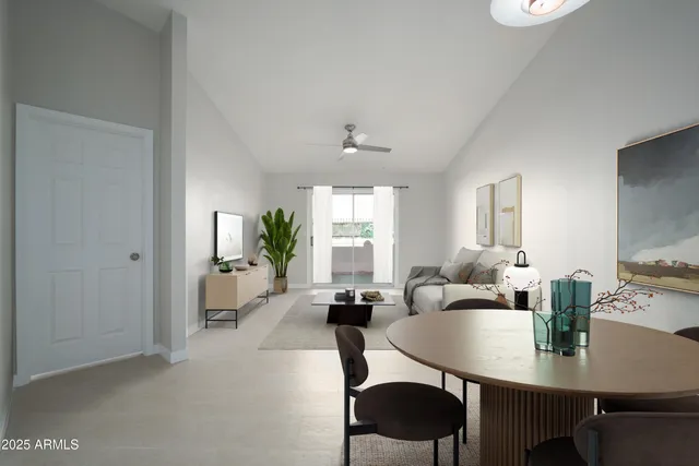 a living room with furniture a window and a table