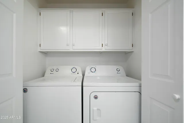 a utility room with dryer and washer