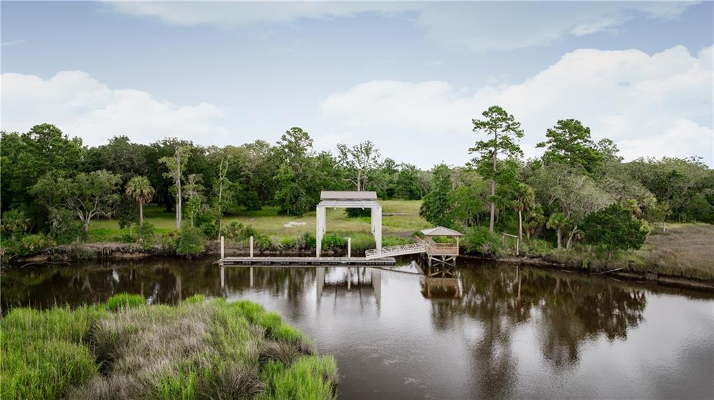 0 Iron Safe Road Brunswick, GA 31523 - Photo 2 of 26 a view of house with outdoor space and lake view