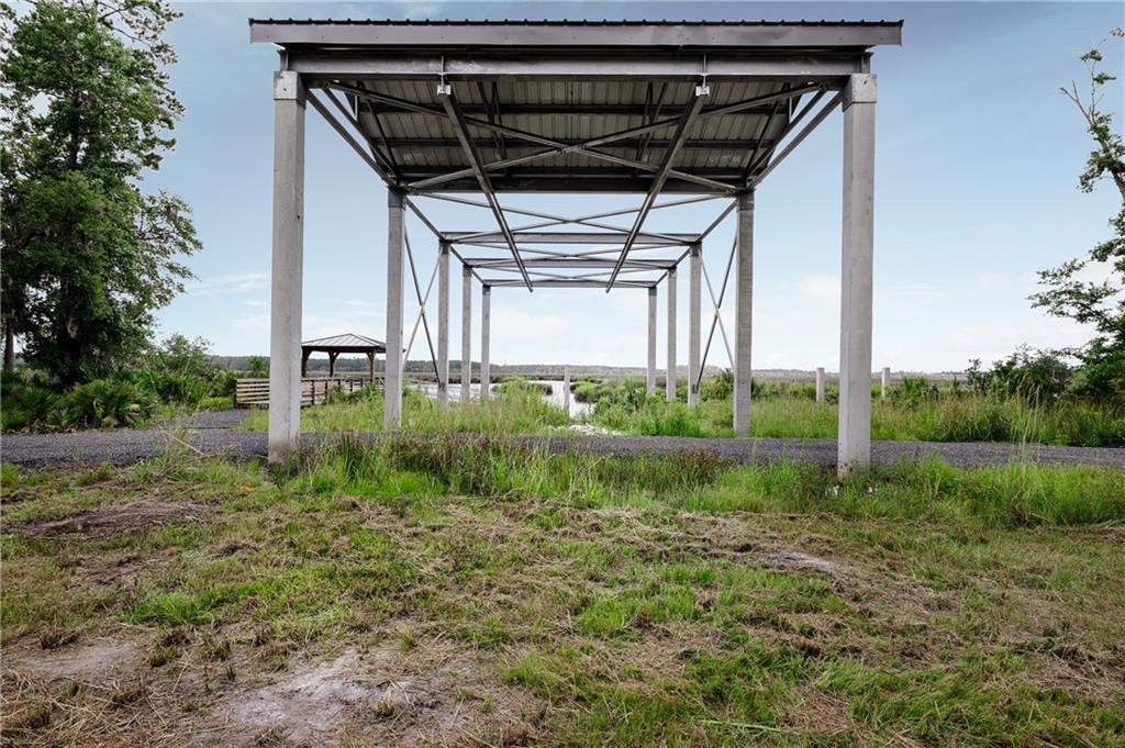 0 Iron Safe Road Brunswick, GA 31523 - Photo 24 of 26 a backyard of a house with lots of green space