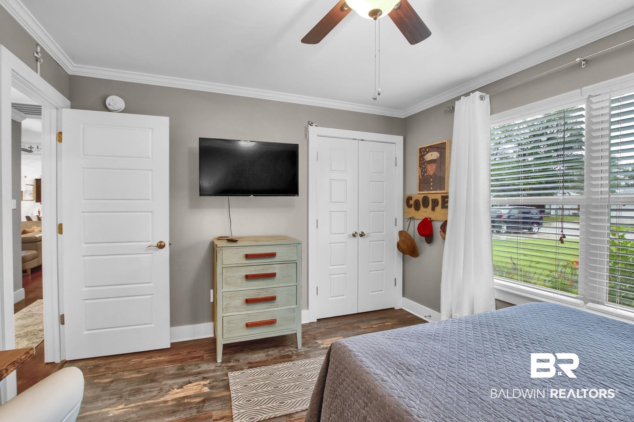 203 Lakefront Circle Summerdale, AL 36580 - Photo 44 of 69 Bedroom featuring ceiling fan, crown molding, dark hardwood / wood-style flooring, and multiple windows