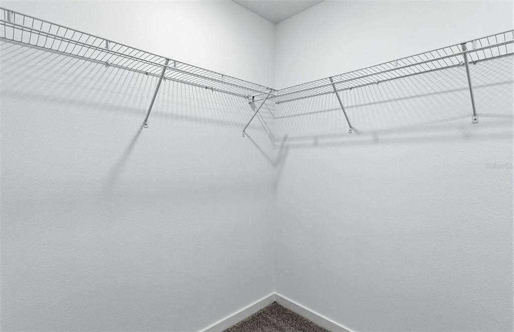 36877 Rio Grande Drive Zephyrhills, FL 33540 - Photo 12 of 26 a view of a room with racks on the wall
