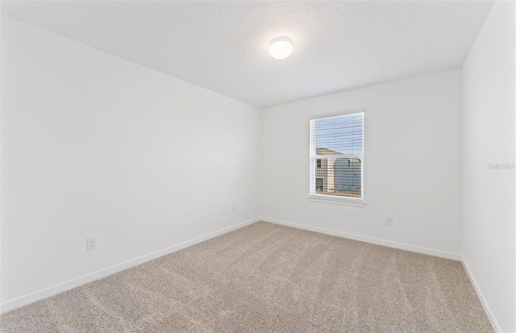 36877 Rio Grande Drive Zephyrhills, FL 33540 - Photo 15 of 26 an empty room with a window