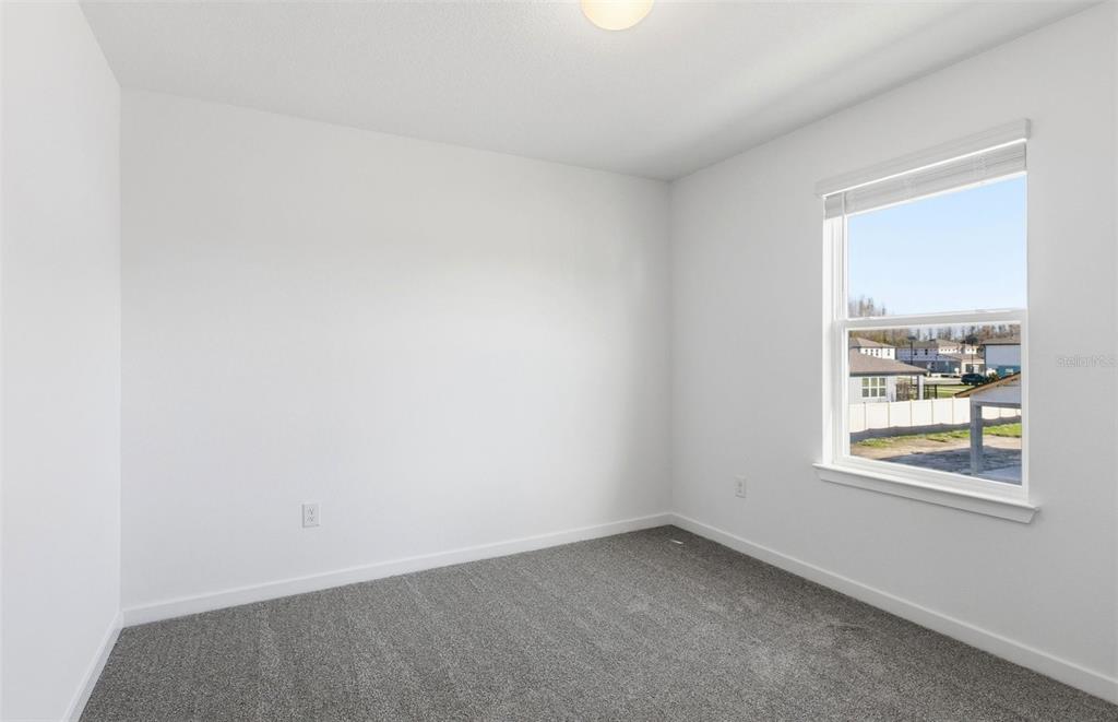 36877 Rio Grande Drive Zephyrhills, FL 33540 - Photo 15 of 26 an empty room with a window