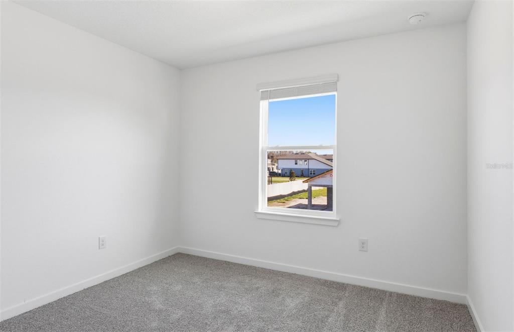 36877 Rio Grande Drive Zephyrhills, FL 33540 - Photo 16 of 26 an empty room with a window