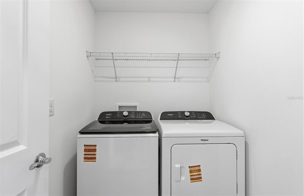36877 Rio Grande Drive Zephyrhills, FL 33540 - Photo 17 of 26 a utility room with dryer and washer