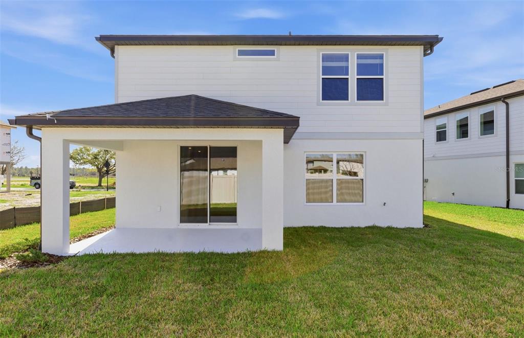 36877 Rio Grande Drive Zephyrhills, FL 33540 - Photo 19 of 26 a front view of a house with a yard