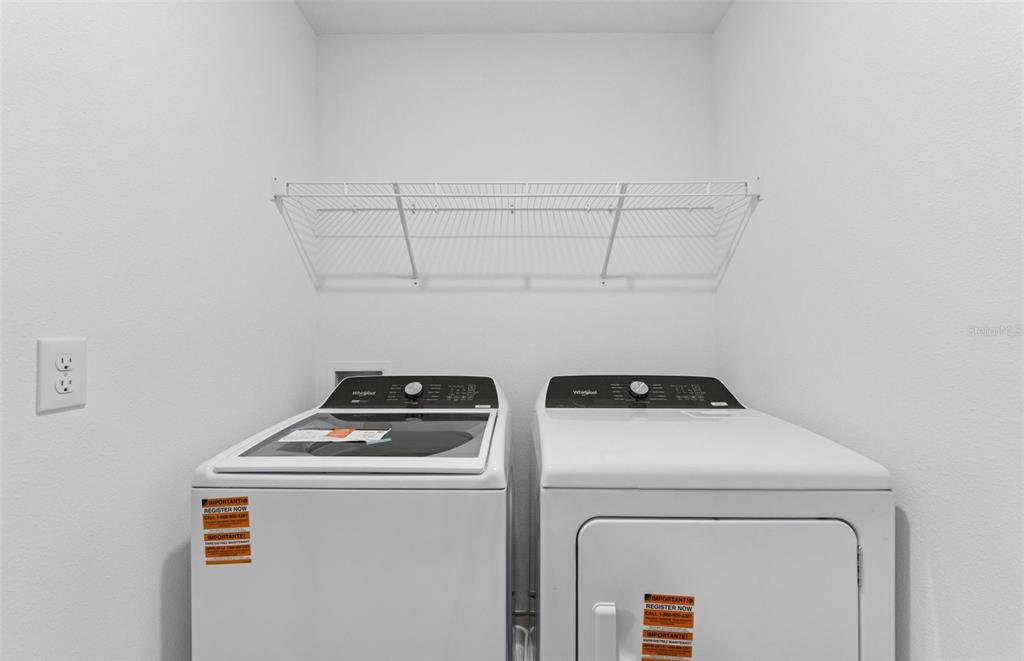 36877 Rio Grande Drive Zephyrhills, FL 33540 - Photo 19 of 26 a close up view of washer and dryer