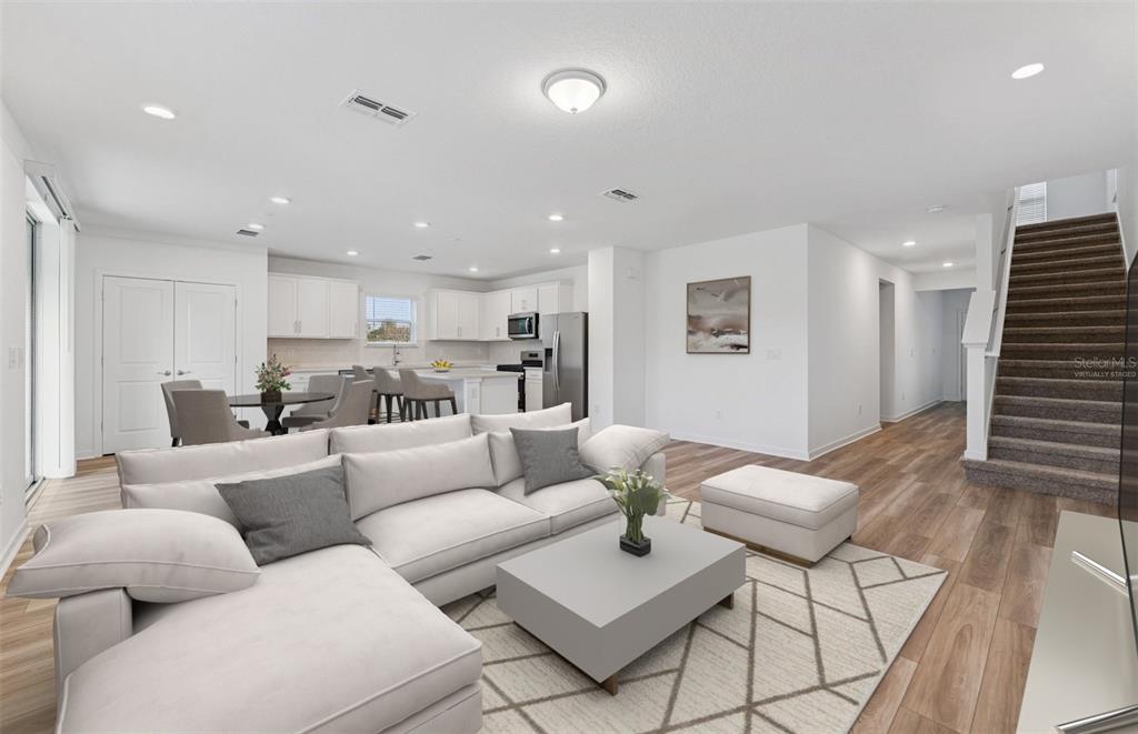 36877 Rio Grande Drive Zephyrhills, FL 33540 - Photo 2 of 26 a living room with furniture kitchen view and a table