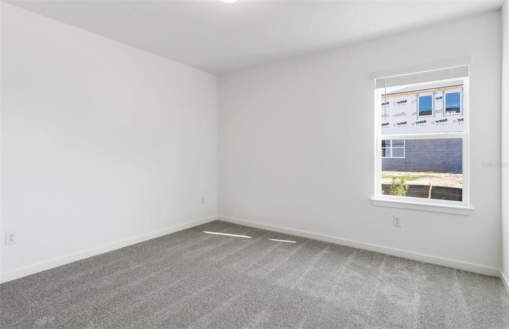 36877 Rio Grande Drive Zephyrhills, FL 33540 - Photo 7 of 26 an empty room with a window