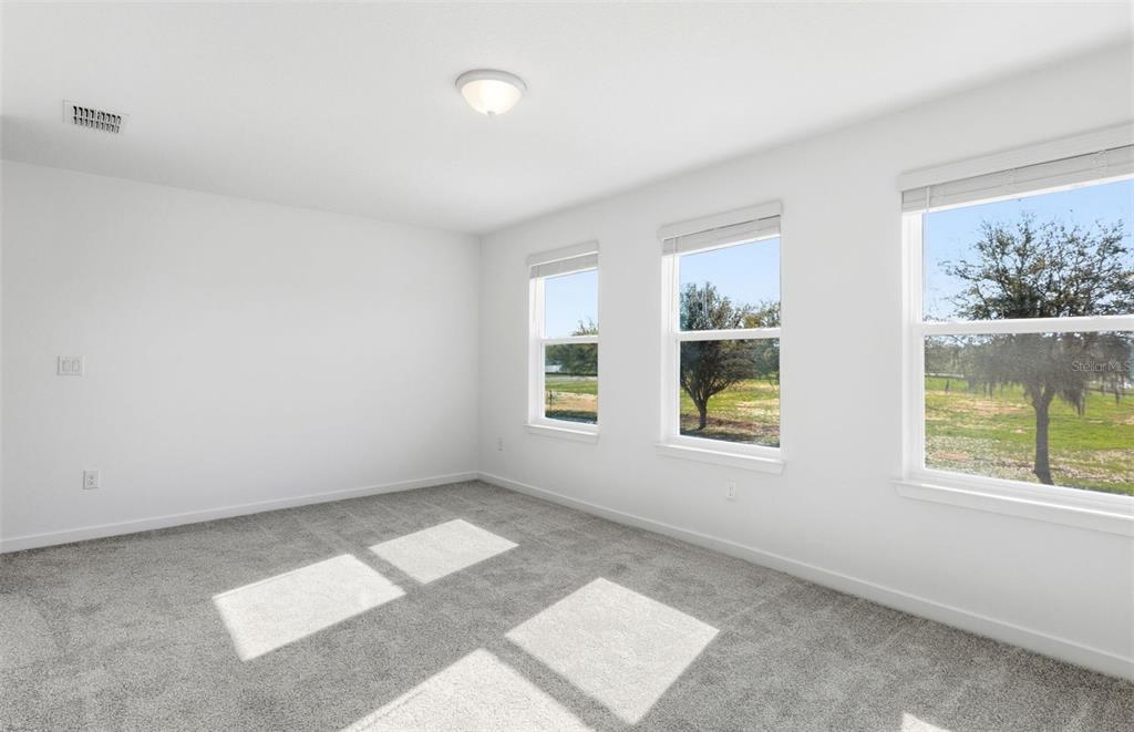 36877 Rio Grande Drive Zephyrhills, FL 33540 - Photo 9 of 26 a view of an empty room with a window