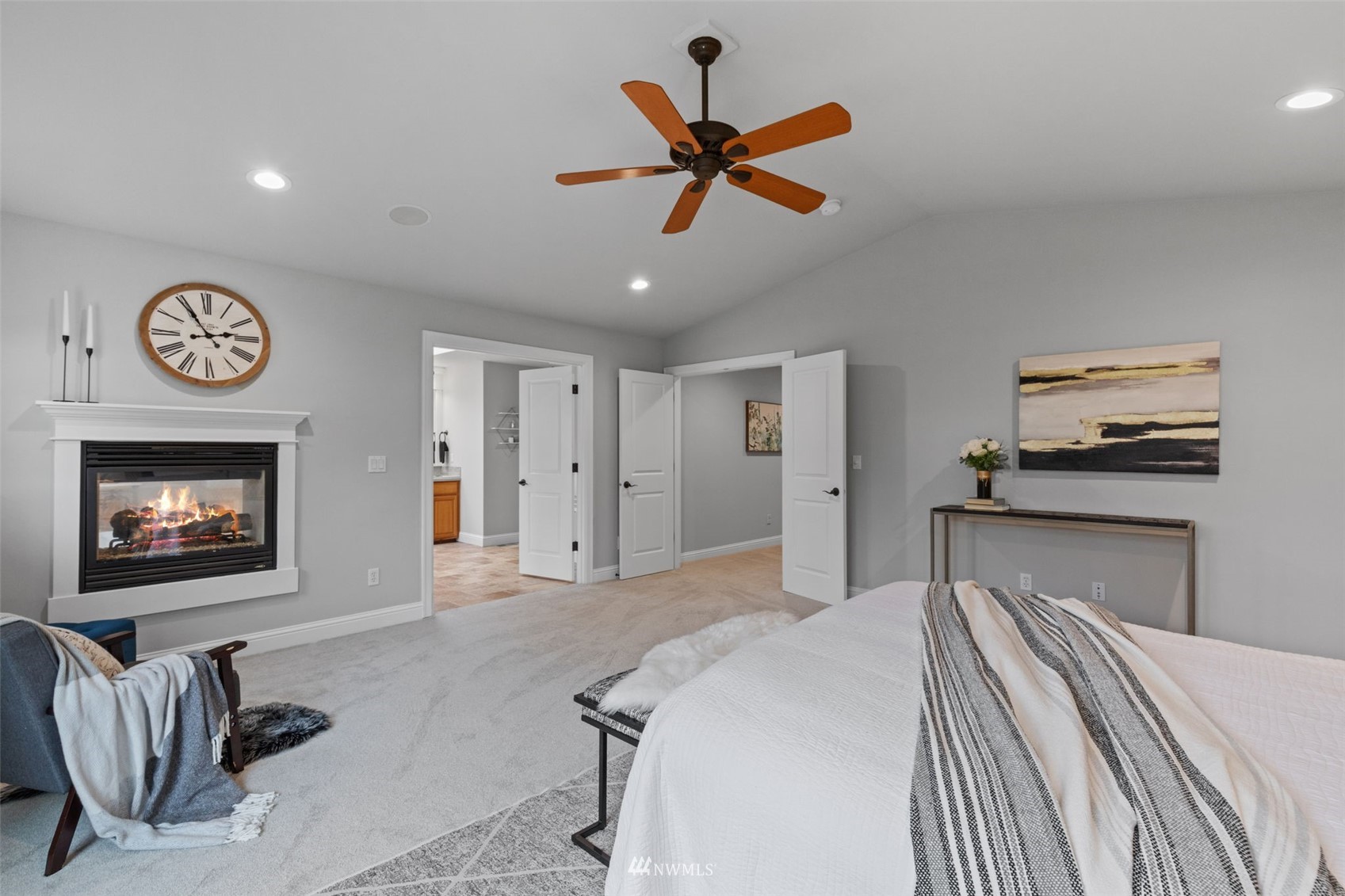 10302 Northeast 194th Street Bothell, WA 98011 - Photo 23 of 40 a bedroom with a bed and a chandelier