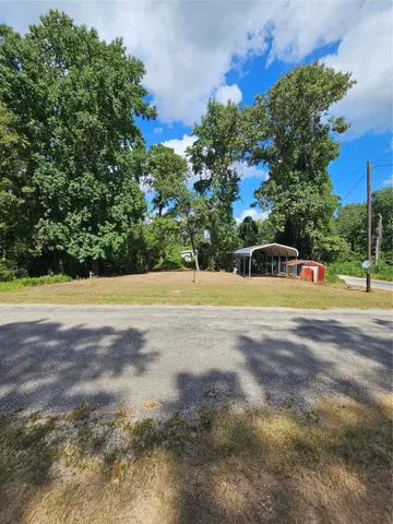 a view of a swimming pool and a yard
