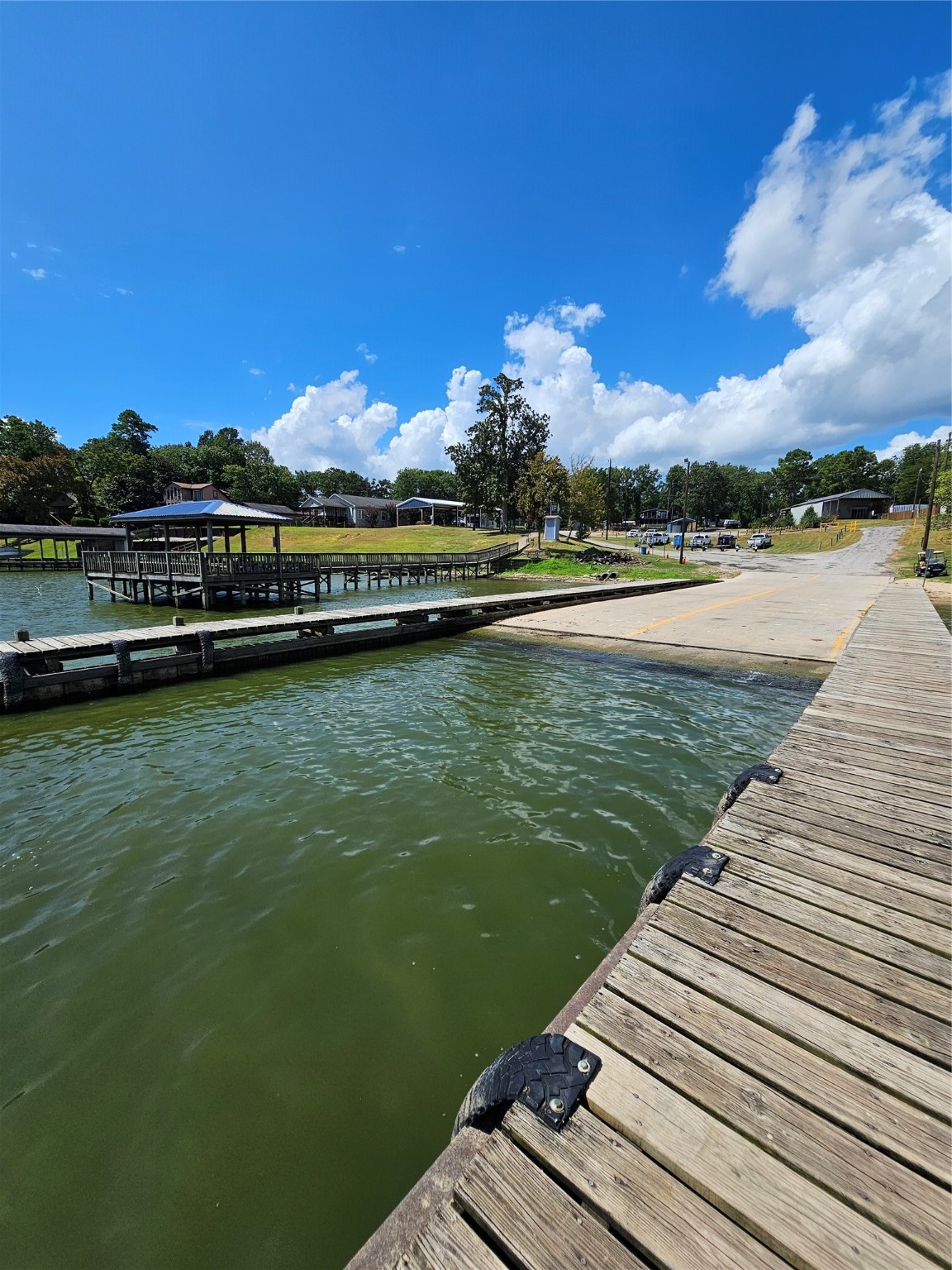 0 Roatan Drive Point Blank, TX 77364 - Photo 20 of 26 a view of a lake with a terrace