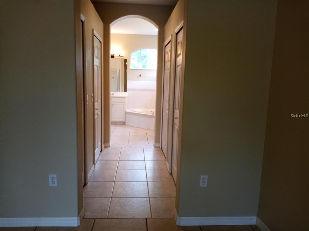 6506 Waters Edge Way Lakewood Ranch, FL 34202 - Photo 4 of 14 a view of a bathroom from a hallway