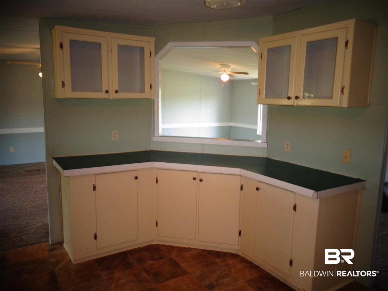 21535 A Glass And Spivey Road Robertsdale, AL 36567 - Photo 13 of 32 Painted wood cabinets.