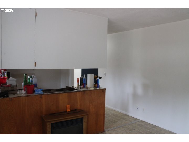 21620 Glaze Road Veneta, OR 97487 - Photo 13 of 36 a kitchen with a sink and cabinets
