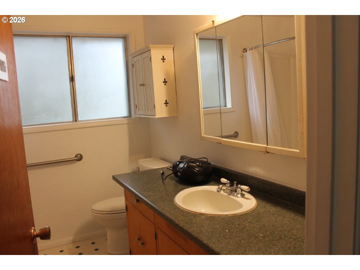 21620 Glaze Road Veneta, OR 97487 - Photo 14 of 36 a bathroom with a sink and a mirror